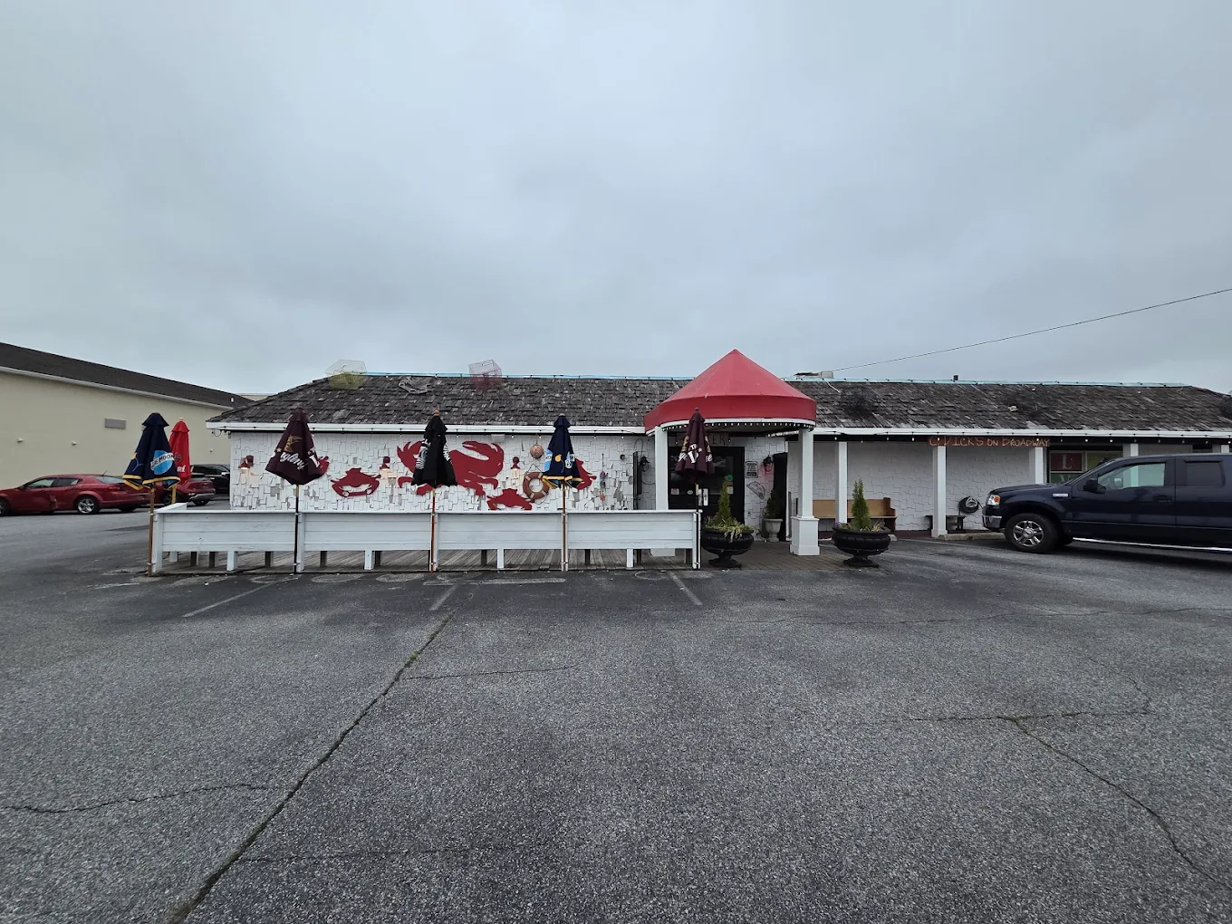 Crabby Dick's restaurant exterior with painted crab mural