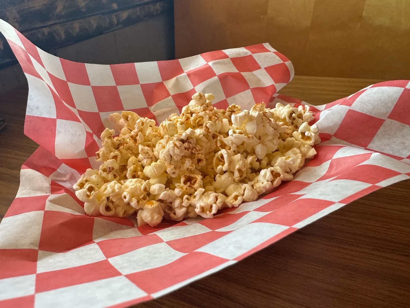 Old Bay seasoned popcorn in a checkered basket