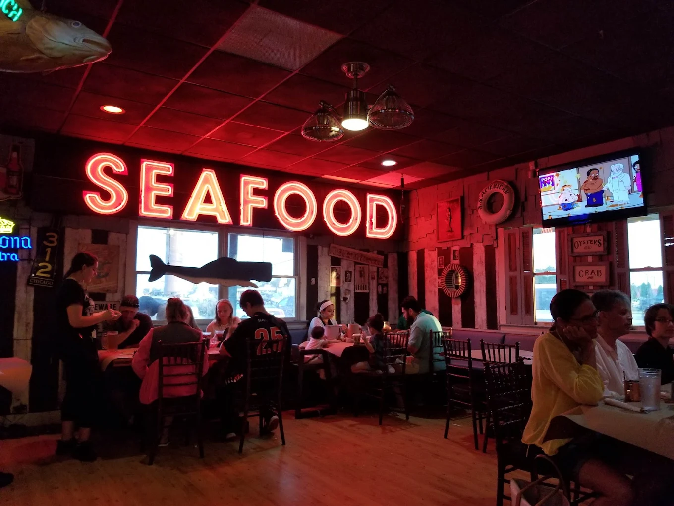 Vintage SEAFOOD neon sign over the dining room